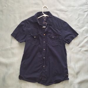 Blue button down t-shirt.